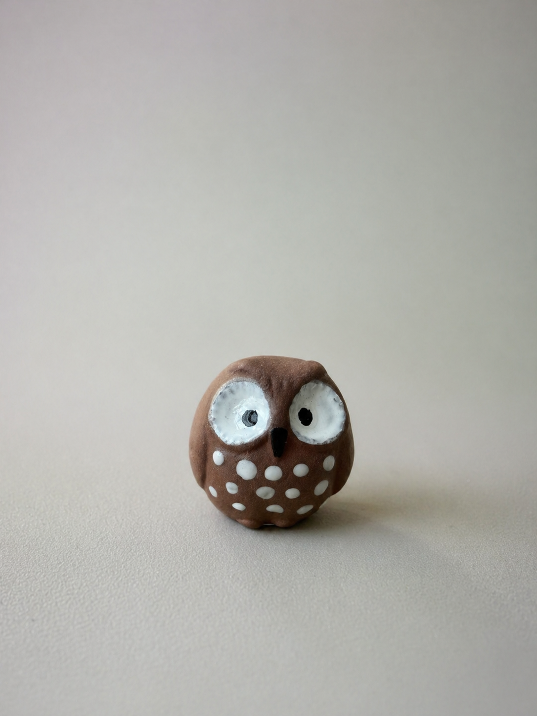 Fukurō hand-built owl charm in terracotta