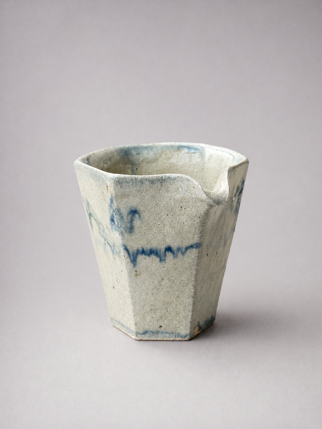 Tsugu faceted pitcher in blue drip glaze